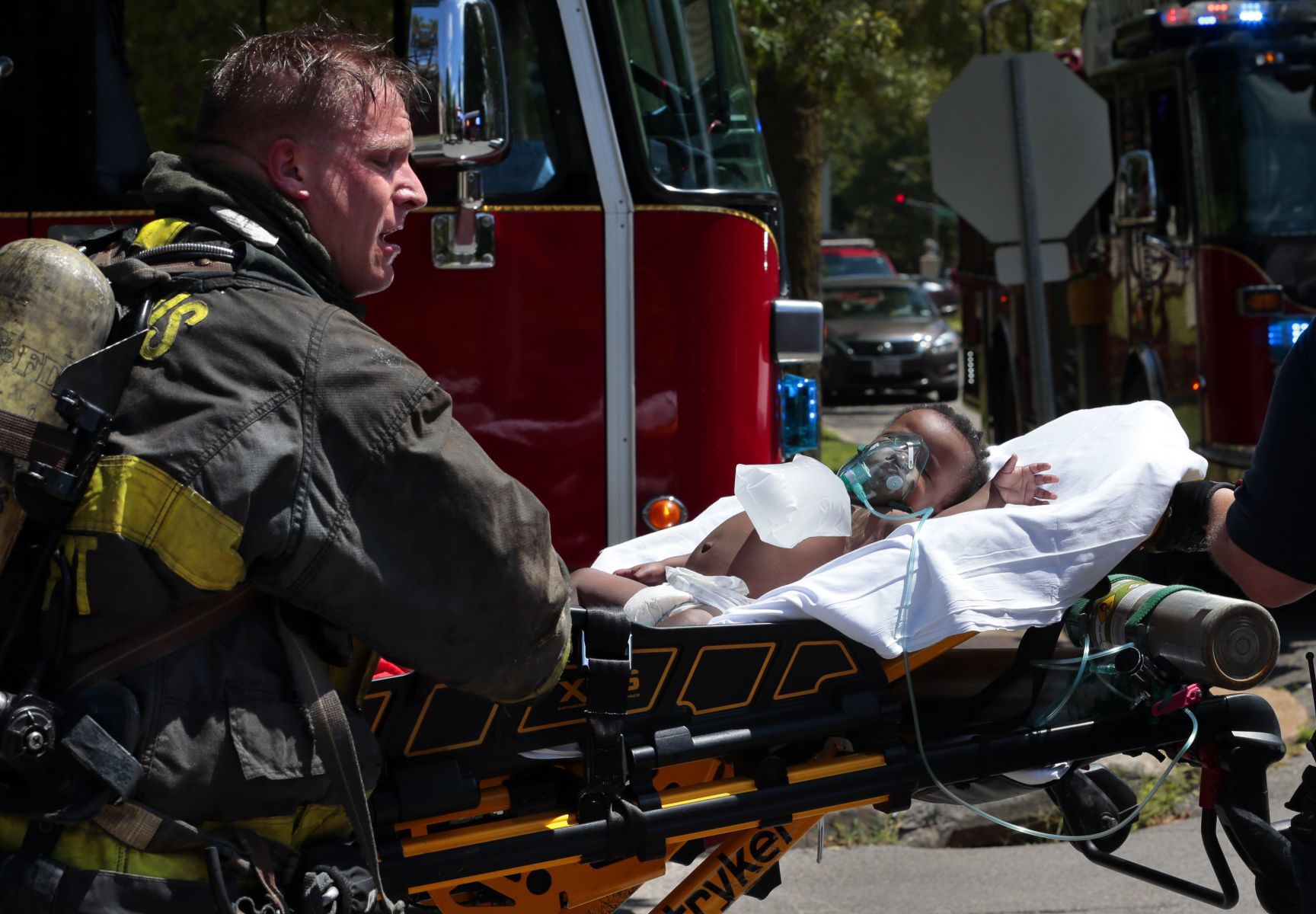 Firefighters rescue four children from burning apartment